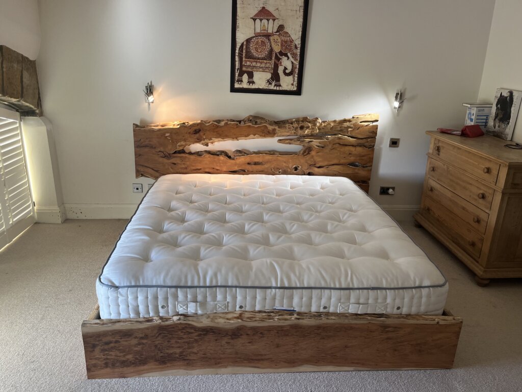 Live edge handcrafted yew bed
